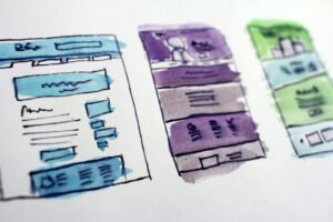 Hand-drawn wireframe sketches of website page layouts